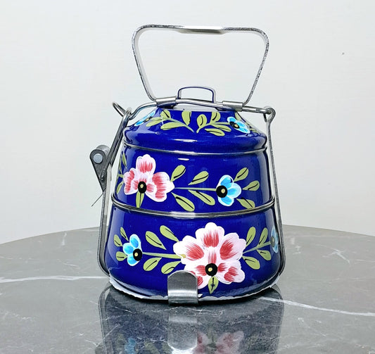 Two-tiered blue bento box with floral designs 