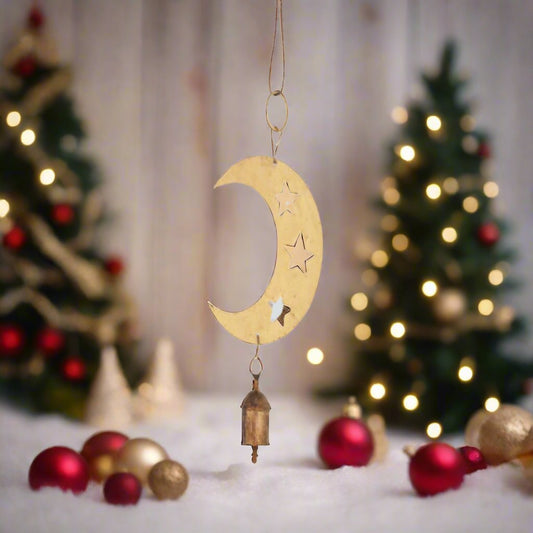  A gold crescent moon and star pendant elegantly suspended from a hook, showcasing intricate design and craftsmanship.