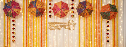 Haldi Mehndi Backdrop Decor Set – Umbrellas, Flower Strings, Potlis, Cushion Covers, Table Runner