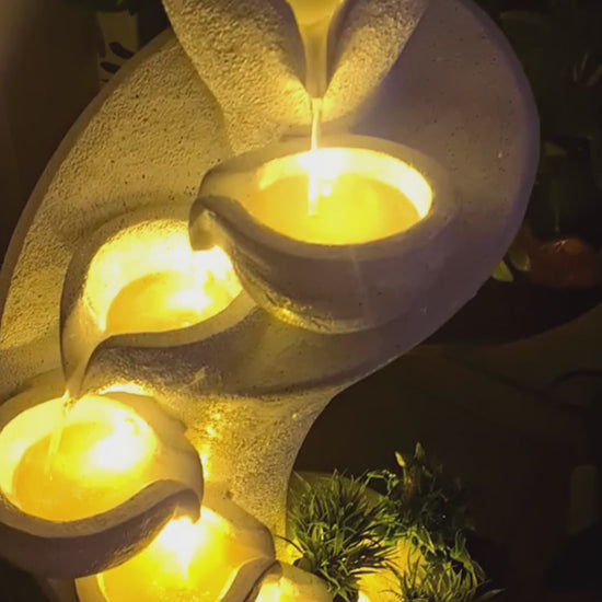 Tall indoor waterfall fountain with cascading water and LED lighting